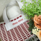 Light MiuMiu basket bag perfect for picnics and summer